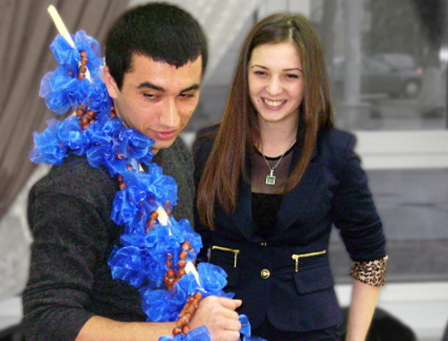 The third Circassian folk game in Adygea, Maikop, March 24, 2012; a student from Syria Umaf Meshvez, the game facilitator, holds the rod named "Dazhue Besch" which means "a stick with a hazelnut". Photo by Oleg Chaly for the "Caucasian Knot".