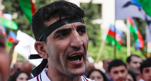 Participant of the rally in Baku, May 30, 2015. Photo by Aziz Karimov for the ‘Caucasian Knot’. Participant of the rally in Baku, May 30, 2015. Photo by Aziz Karimov for the ‘Caucasian Knot’.