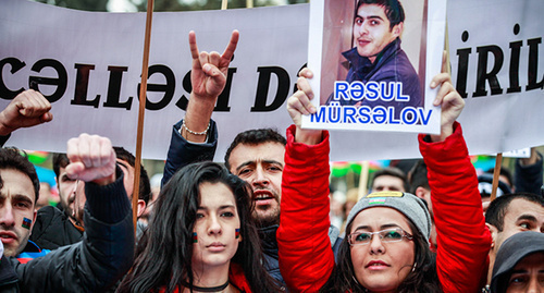 Rally participant holds portrait of political prisoner, Baku, March 125, 2015. Photo by Aziz Karimov for the ‘Caucasian Knot’.  