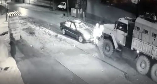 Law enforcers arrive at the house of Isa Tsechoev, village of Ali-Yurt, March 5, 2017. Screenshot of video posted at https://www.instagram.com/p/BRQQGz9hiZ0/?taken-by=tsechoy