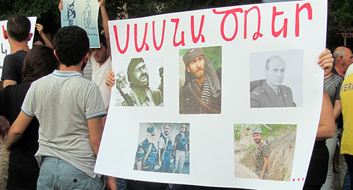 Photos of the attackers who seized the building of the police regiment of the patrol-and-post service in Yerevan. An inscription on the poster: "Sasna Tsrer". Photo by Tigran Petrosyan for "Caucasian Knot"