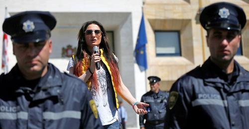 LGBT activist surrounded by policemen delivers speech, Tbilisi, May 2017. Photo: REUTERS/David Mdzinarishvili 