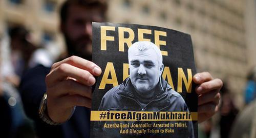 Banner with Afghan Mukhtarly's portrait. Photo: REUTERS/David Mdzinarishvili