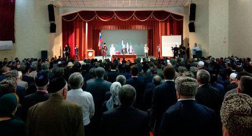 The audience listens to a speech at a the World Congress of the Ingush People. Photo by Fortanga Org https://www.youtube.com/watch?time_continue=765&amp;v=xDpecbx8eBs