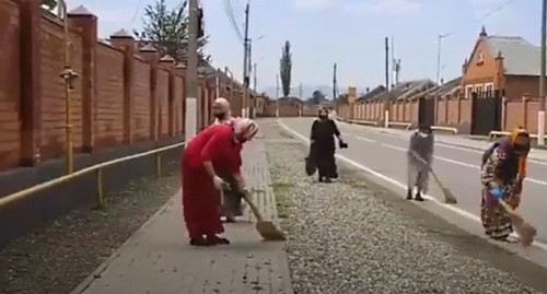 A subbotnik (voluntary clean-up work day) in Chechnya. Screenshot of the video at the "Шалинское телевидение" YouTube channel https://www.youtube.com/watch?time_continue=18&amp;v=0PvsR5dMrZ4&amp;feature=emb_logo