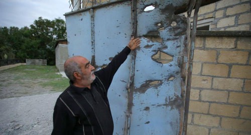 Resident of Azerbaijani village shows traces of shelling attacks. Photo by Aziz Karimov for the Caucasian Knot 