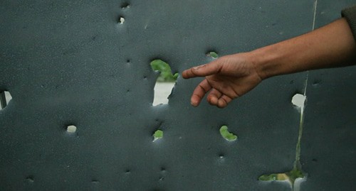 Gates with traces from shelling attacks. Photo by Aziz Karimov for the Caucasian Knot 