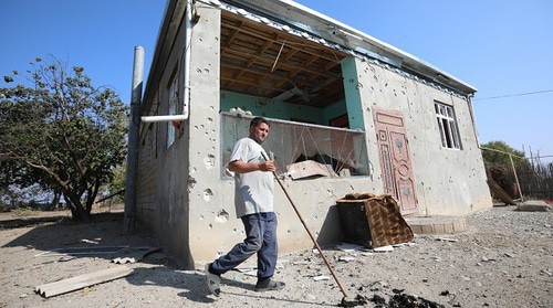 Natig Garaev, a resident of the Agdam District, near the house damaged by shelling. Photo by Aziz Karimov for the "Caucasian Knot"