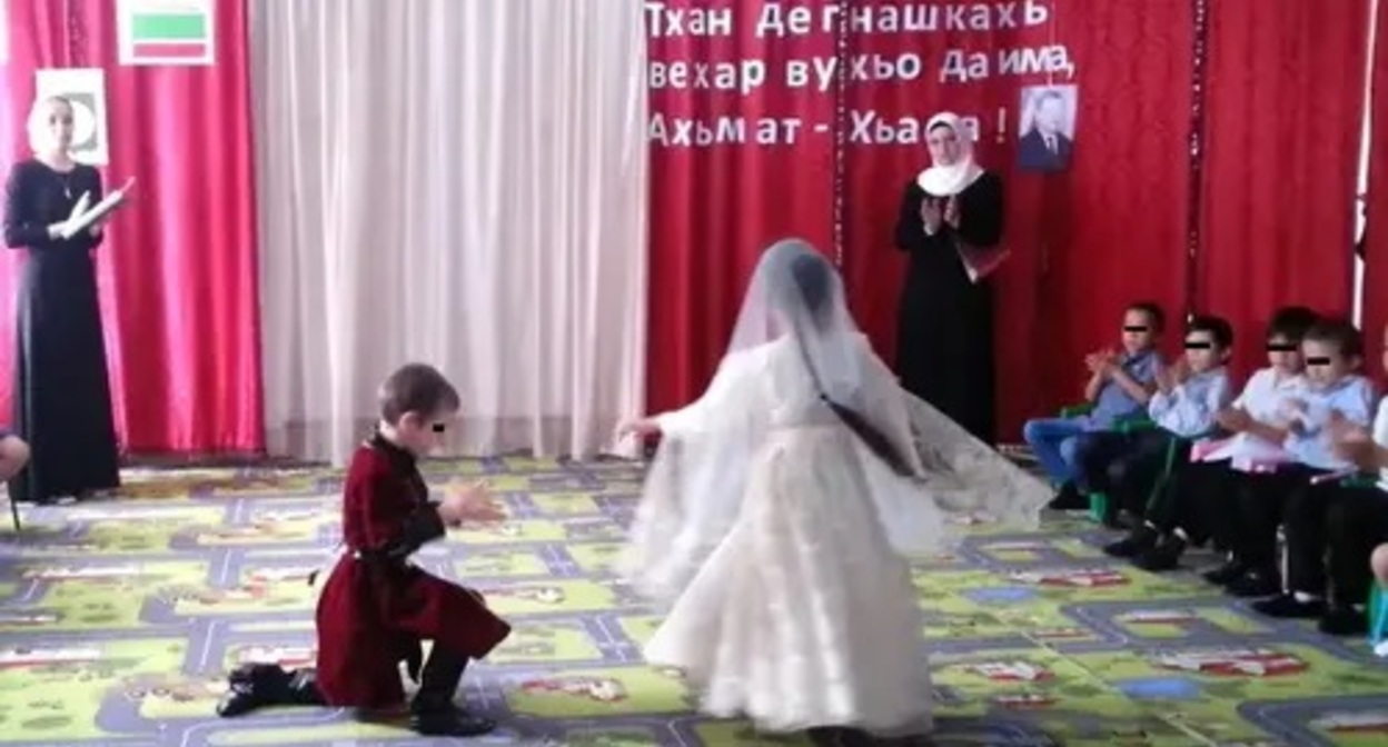 A graduation matinee in a kindergarten. Image made from video posted by Isa Dulaev Channel, https://www.youtube.com/watch?app=desktop&v=F3knShtVaHQ