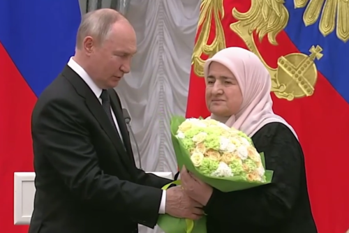 Vladimir Putin and Aimani Kadyrova. Screenshot of the video posted on Ramzan Kadyrov's Telegram channel on August 2, 2023 https://t.me/RKadyrov_95/3794