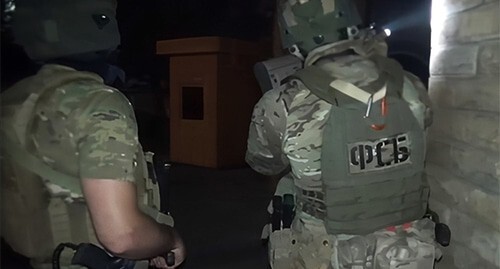 Law enforcers at the scene. June 2024. Screenshot of a video by the Russian FSB