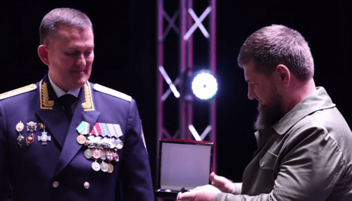 Ramzan Kadyrov receives an award from Dmitry Kechkin (left). Screenshot of a video posted on Kadyrov's Telegram channel on October 19, 2024 https://t.me/RKadyrov_95/5181