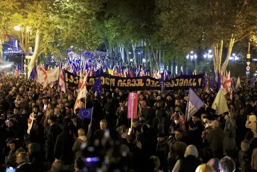 People at a rally holding posters calling for Georgia's European Union integration. Photo: Guram Muradov/Civil.ge