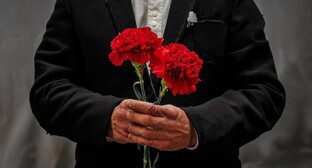 A man with carnations. Picture made in Photoshop by the "Caucasian Knot"